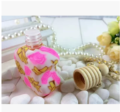 Apple shaped clay bottle car perfume pendant car perfume bag details Picture